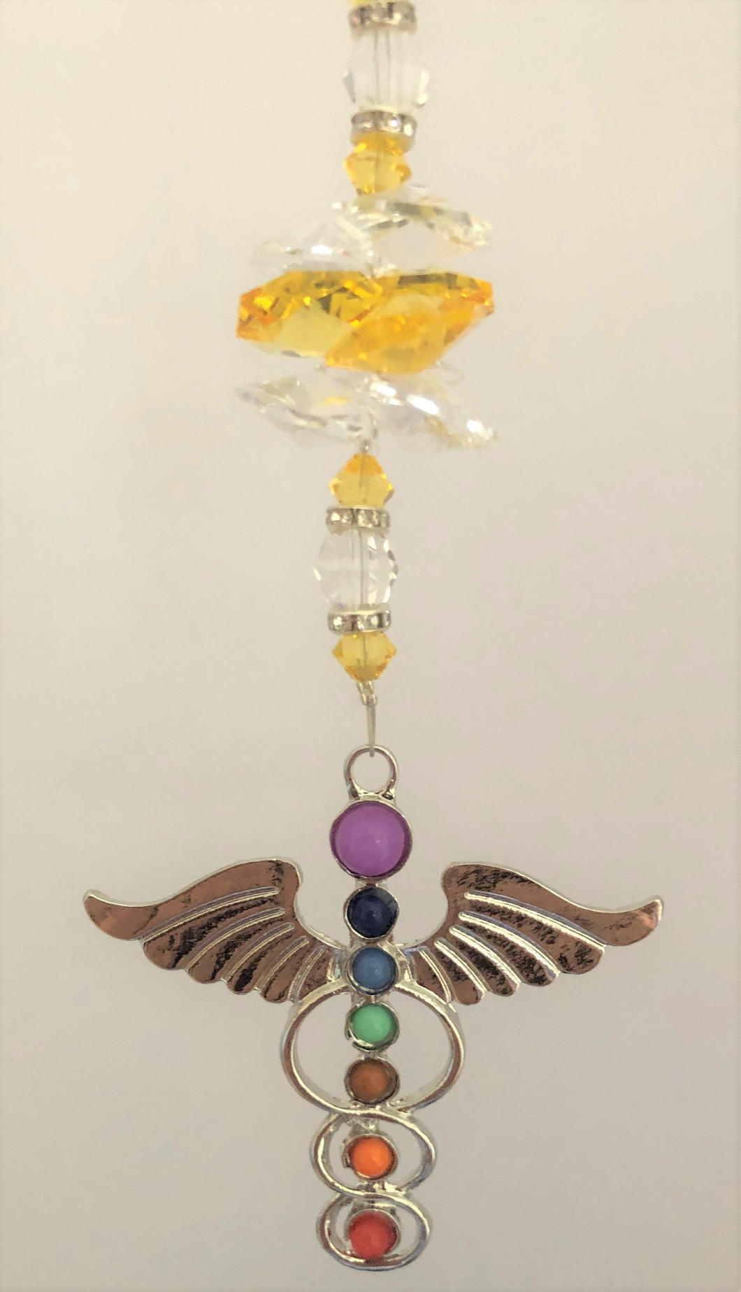 This beautiful Chakra Angel Wings suncatcher which is decorated with crystals and Citrine