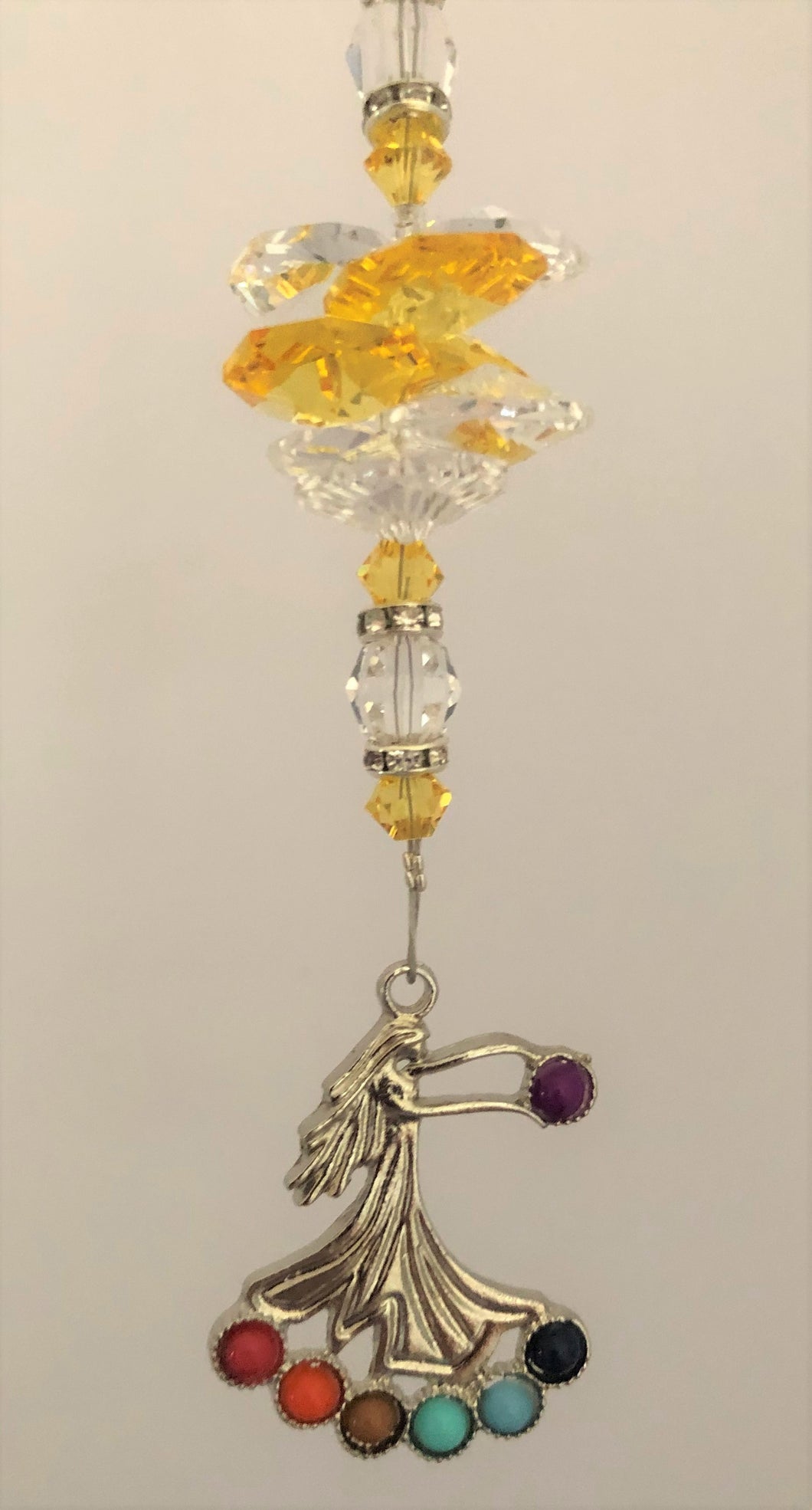 This beautiful Chakra girl suncatcher which is decorated with crystals and Citrine