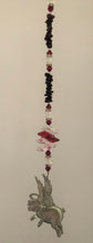 Load image into Gallery viewer, This beautiful Pig Flying suncatcher which is decorated with  crystals and Garnet
