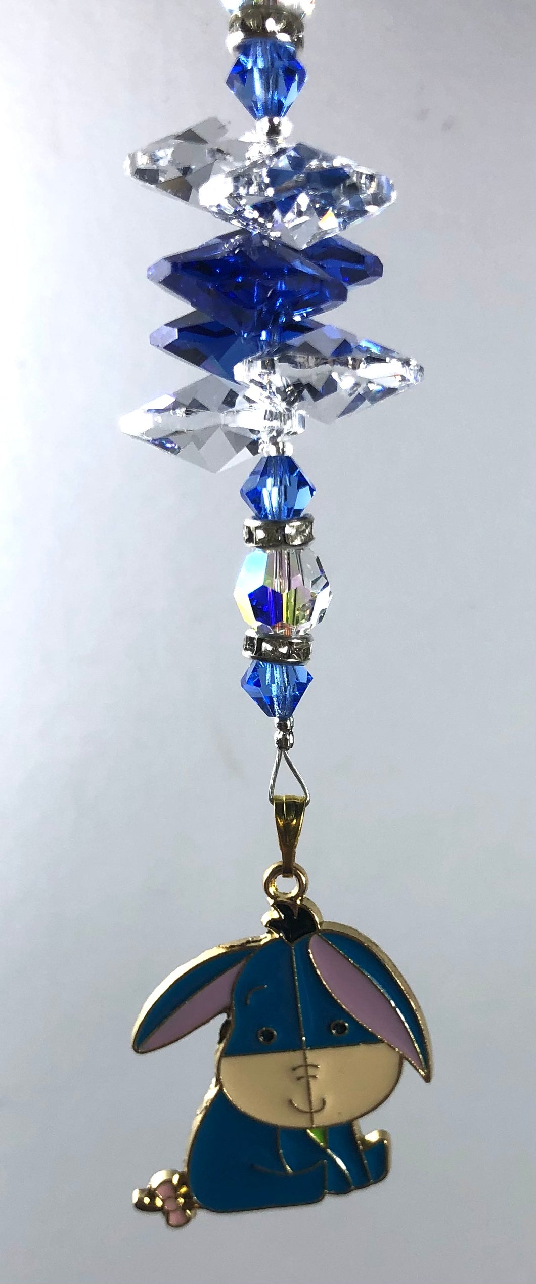 Eeyore suncatcher decorated with crystals and lapis lazuli gemstones