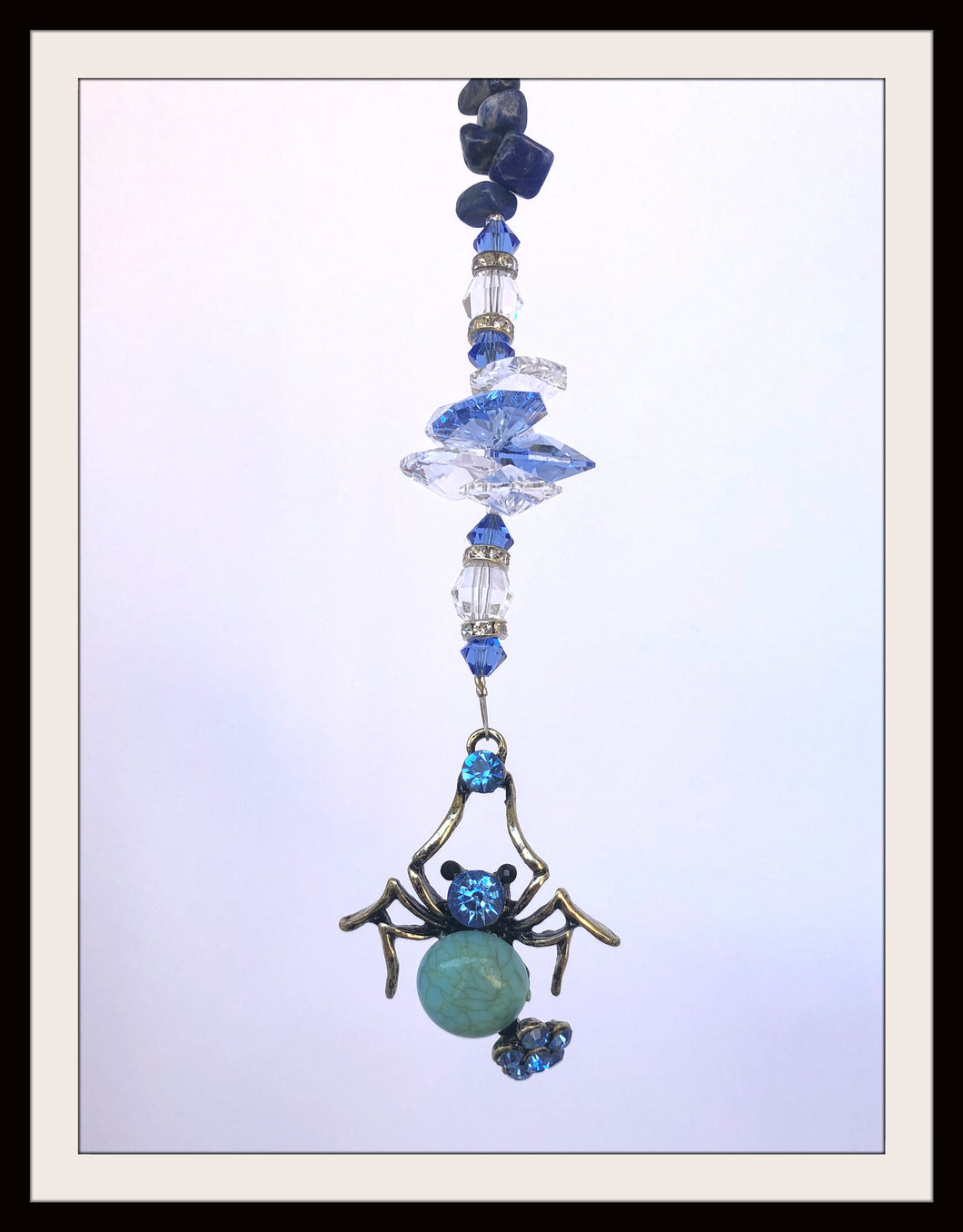 This beautiful Spider blue suncatcher which is decorated with crystals and Lapis Lazuli